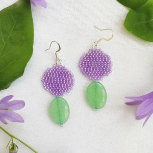 Purple disc w/ green stone