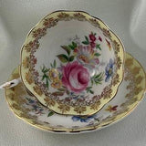 Beautiful Paragon Soft Yellow Teacup and Saucer Duo with Gorgeous Gold Filigree and Bouquet of Flowers.