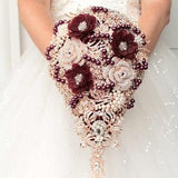 Rose gold cascade brooch bouquet. Burgundy wedding bouquet