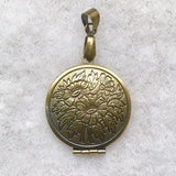 Victorian style vintage copper pendant / locket on spinner .