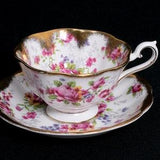 Rare Royal Albert with lavish gold and cabbage rose bouquets on cup and saucer