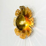 A brass sunflower shaped sconce by Svend Aage Holm Sorensen | 1960s | Denmark