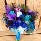 Purple blue bridal bouquet with teal, rhinestone, peacock feather accent