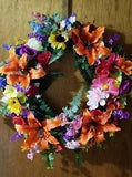 Wreath  Beautiful summer flowers and greenery on grapevine wreath. $65
