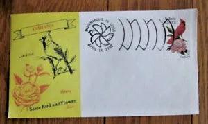 Vintage collectible envelope with cardinal and peony illustration, plus stamp labels