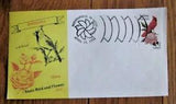 Vintage collectible envelope with cardinal and peony illustration, plus stamp labels