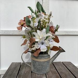Rustic watering can tin Centerpiece with dusty mauve Cosmos, white Lilies & Dogwood blossoms with Pussy Willow and Baby's breath filler