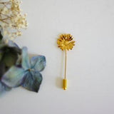 Golden fibula brooch sunflower hat pick