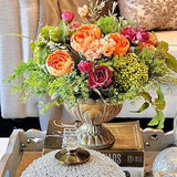 Fall floral centerpiece of plum-red roses & orange peonies in gold metal vase, Faux silk flower arrangement, artificial green fern, berries