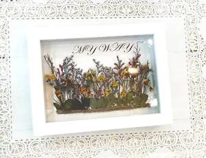 dried pressed flowers in wood frame with caligraphy?