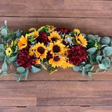 Burgundy dahlias + sunflowers table piece for bride and grooms table