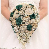 Emerald green and gold brooch bouquet. Cascade green wedding bouquet. Gold jeweled luxury bouquet.