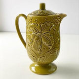 Unique vintage avocado green teapot with floral orchid raised bebossed pattern.