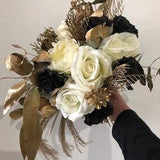 Gorgeous black, gold and white bridal bouquet