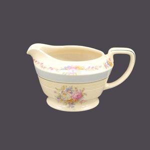 Wood & Sons creamer jug. Wood's Ivory Ware made in England. Central bouquet with roses, light blue band.