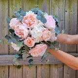 Bridal peonies bouquet with touch of roses