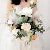 Bridal bouquet with silk flowers,roses,chrysanthemum,peonies, pampas gras, foliage, eucalyptus leaves. Boho and rustic wedding bouquet.