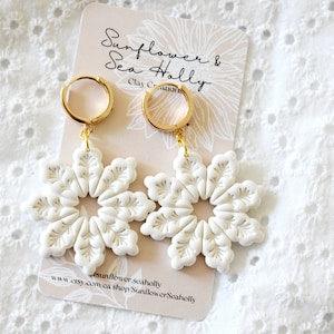 White Pearlescent Snowflake Polymer Clay Earrings