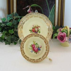 EB Foley - Cream Colored Floral Bouquet Center Gold Filigree Tulip Shape Teacup and Saucer