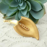 Vintage Peace Lily Orange Rhinestone Center Matte Gold Tone Pin Brooch