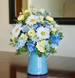 Vintage Blue Enamel Coffee Pot with a Silk Arrangement of Blue, Yellow And White