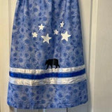 Teen traditional Metis ribbon skirts blue sunflowers with satin ribbons, it has stars and bear design. Handmade with love.