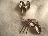 Silvertone Lily on Twisted Stem brooch / pin.