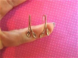 Rose gold lily ear climbers