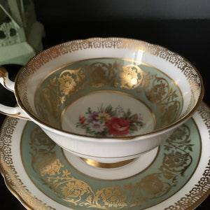 Vintage Gorgeous Paragon Teacup and Saucer, Green with Heavy Gold, floral pattern in the centre, Rose with bouquet of flowers,stunning