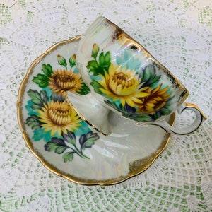 Japan pedestal hand painted teacup and saucer 1950??s.
