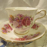 Queen Anne teacup and saucer, pink floral, footed gold trim, elegant handle,flower bouquet, summer tea  party, cottage chic, 40's vintage