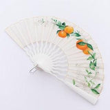White silk fan inspired by Seville. Bridal fan decorated with a bouquet of oranges, orange blossoms and lilies.
