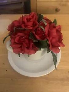 Artificial Red Flowers in Tea Cup and Saucer