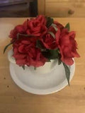 Artificial Red Flowers in Tea Cup and Saucer