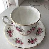Staffordshire Fine Bone China - tea cup and saucer with rose bouquets on white