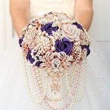 Royal purple brooch bouquet. Rose gold cascading glamour plum wedding bouquet
