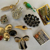 Assorted vintage brooches. Each sold separately.
