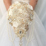 Gold ivory brooch bouquet. Cascade Old Hollywood bridal bouquet