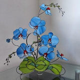 Stained glass orchid,blue glass flower with plant leaves on metal stand,large sculpture,consists of several branches,3D stained glass flower