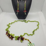 Crochet romantic necklace and earrings set with acrylic flowers, shell butterflies, and seedbeads linked with a silk thread.