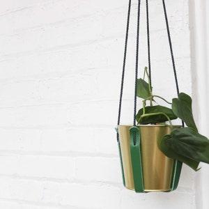 Adjustable plant hanger in green leather