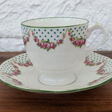 Tuscan China Teacup and Saucer, Plant, White with Green Polka Dots and Pink Roses, English Bone China, 1936-47