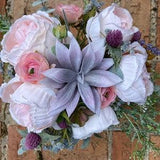 Pink rose and succulent bouquet