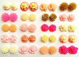 Assorted flower clip-on stud earrings with pink, cream, and yellow rose designs