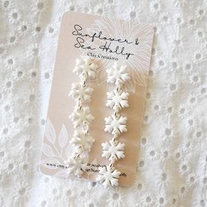 White Pearlescent Snowflake Dangling Polymer Clay Earrings