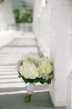 Bride's bouquet - White hydrangeas, babies breath and greenery. Stems wrapped with burlap and lace. Flower Delivery