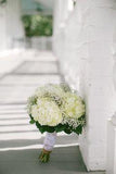 Bride's bouquet - White hydrangeas, babies breath and greenery. Stems wrapped with burlap and lace. Flower Delivery