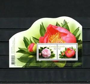 Canada postage stamp featuring pink peony flowers with strawberry and rose sprig