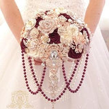 Cascading burgundy rose gold brooch bouquet.