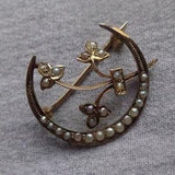 Edwardian 10k. gold crescent moon pin with seed pearls